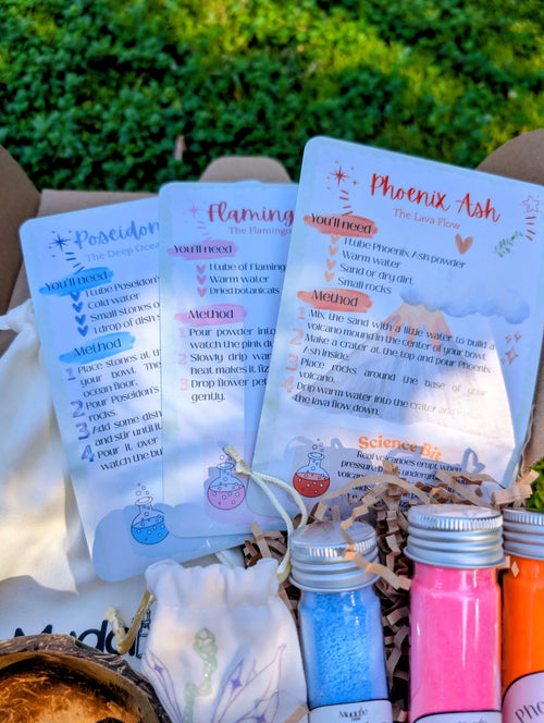 Muddle & Play kit with recipe cards, test tubes and jars laid out in the box