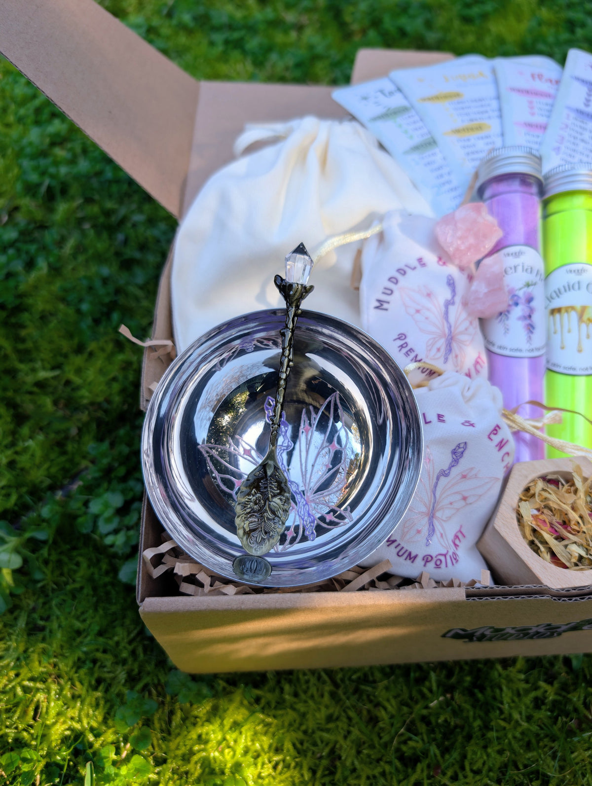 Muddle & Enchant kit with a steel bowl and spoon, pink crystals, bag and test tubes